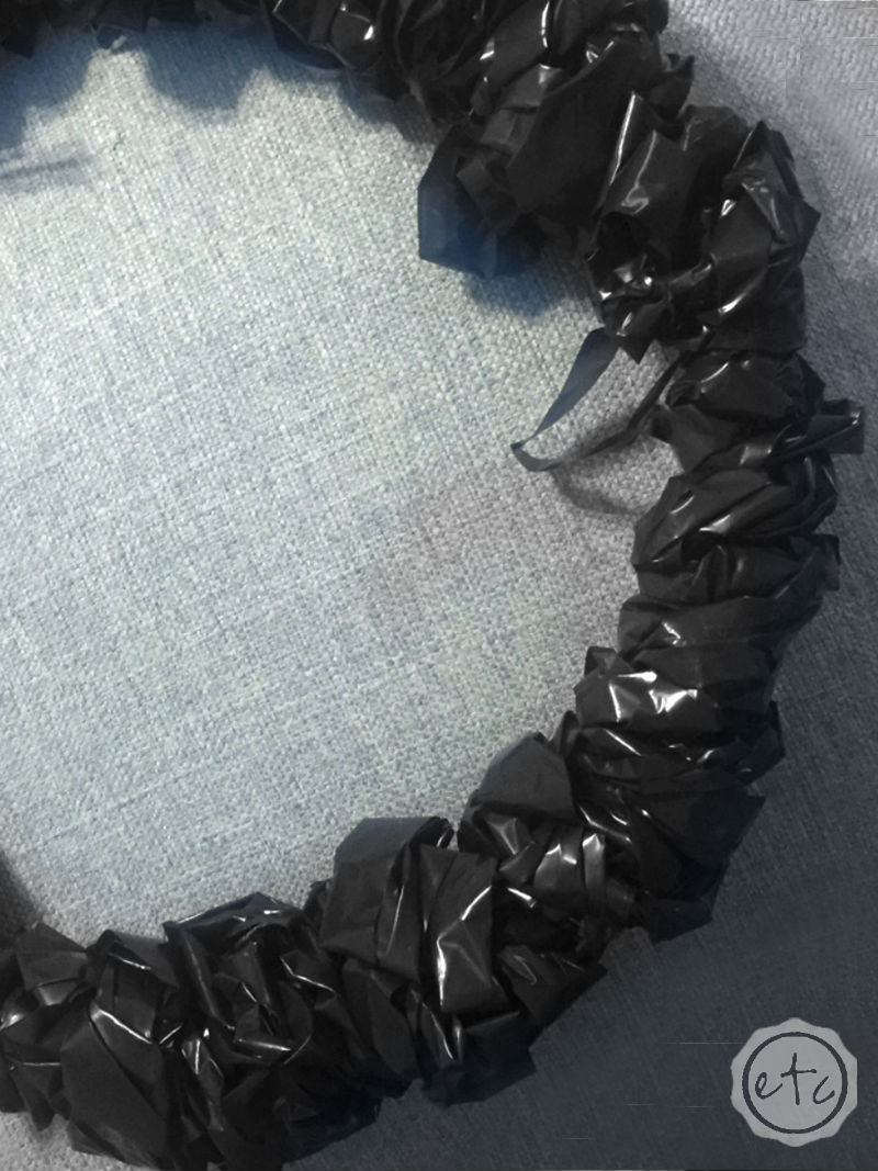 How to Make a Fun Halloween Wreath with a Coat Hanger and Hefty Trash Bags!