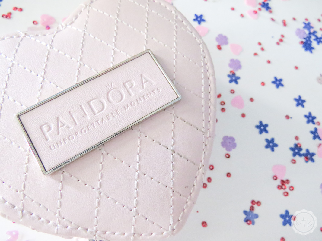 Showing off the "unforgettable moments" tagline of Pandora on this little heart shaped jewelry wallet