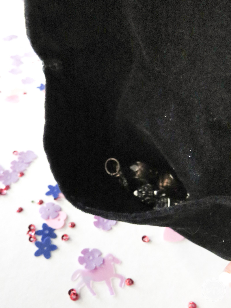 Close up of pandora charms inside a black anti-tarnish bag