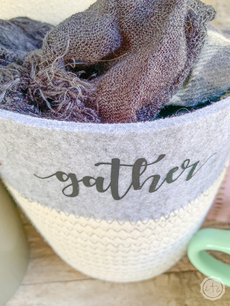 A felt topped rope storage basket with the word "gather" added to the top with iron on vinyl. 