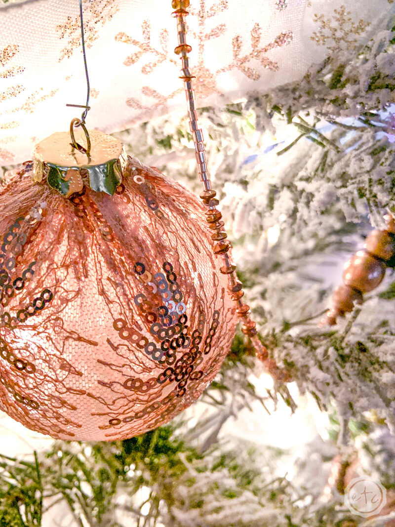 a rose gold sequin ball ornament 